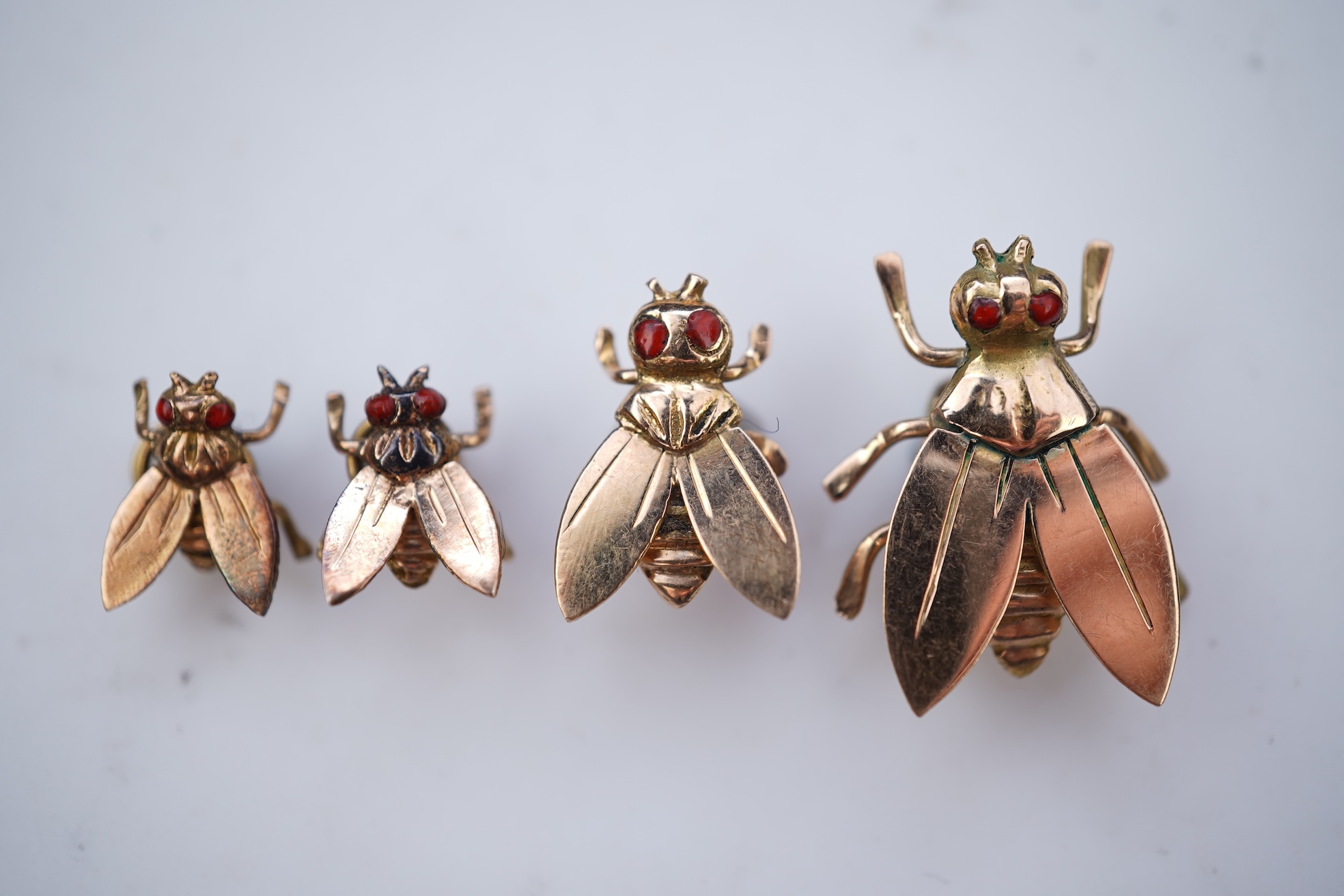 A set of four Retro gold and enamel buttons, mid 20th century